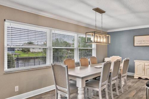 a dining room with a table and chairs at Fleming Ct Pool Home - Palm Coast in Palm Coast