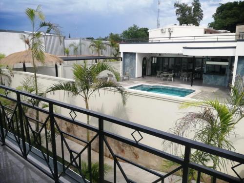 a view of a house with a swimming pool at Hotel Oasis-Dream Holidays - La Petite France in San Bernardino