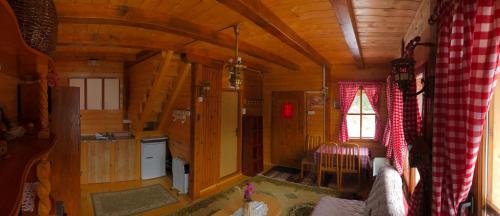 a view of a kitchen and a room in a cabin at Brvnare Grujić Zlatibor in Zlatibor