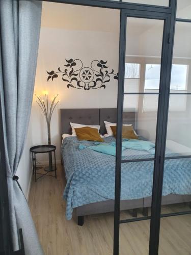 Posteľ alebo postele v izbe v ubytovaní Apartament XAVIER Kościelisko