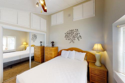 a bedroom with a white bed and a window at Long Island Village Unit 347 in Port Isabel