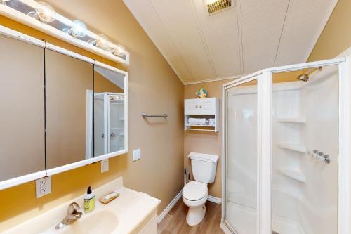 a bathroom with a shower and a toilet and a sink at Long Island Village Unit 347 in Port Isabel