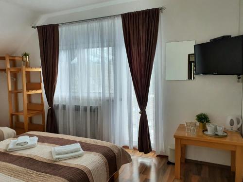 Postel nebo postele na pokoji v ubytování Guesthouse Kovačević