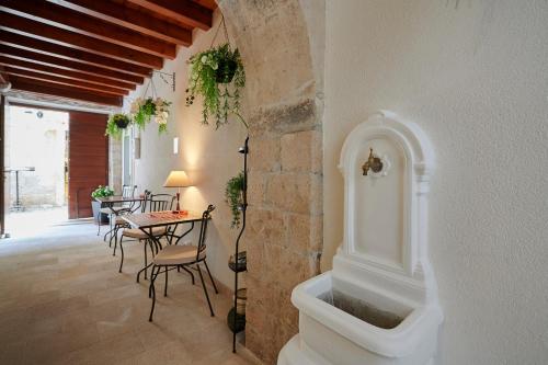 a living room with a sink in the corner of a building at Palace Central Square in Trogir