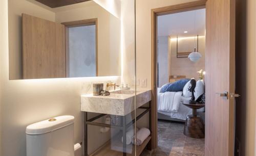 Postel nebo postele na pokoji v ubytování Hotel Voilá Centro Histórico
