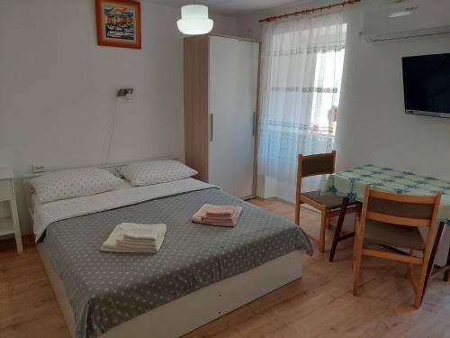 Postel nebo postele na pokoji v ubytování Rooms Mario