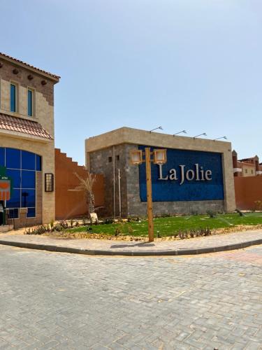 a building with a sign that reads la jolla at Chalet in La Jolie Marina El Ain El Sokhna - Egyptian Families Only in Ain Sokhna