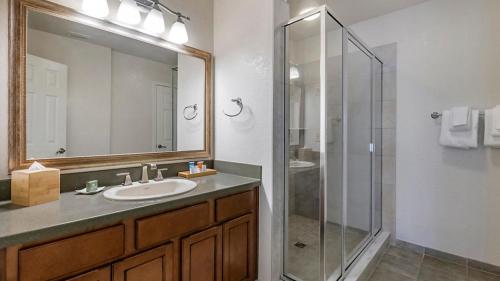 a bathroom with a sink and a glass shower at Hilton Vacation Club St Augustine in Saint Augustine