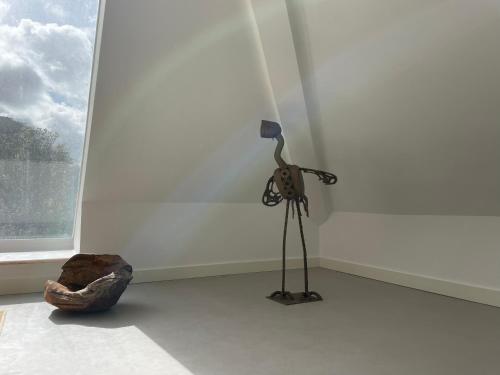 a camera on a tripod in a room with a window at Cedros Nature House in Sintra