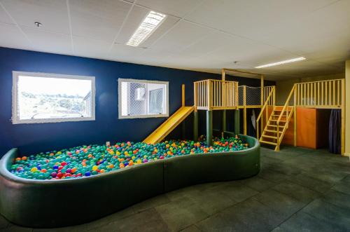 a room with a ball pit in the middle of a play room at Cyan Resort by Atlantica in Itupeva