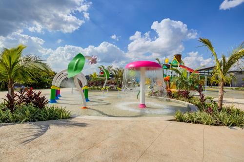 a water park with a sprinkler in a park at Cyan Resort by Atlantica in Itupeva
