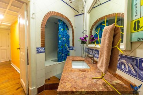 a bathroom with a sink and a shower in it at Lisbon Angels Hostel in Lisbon