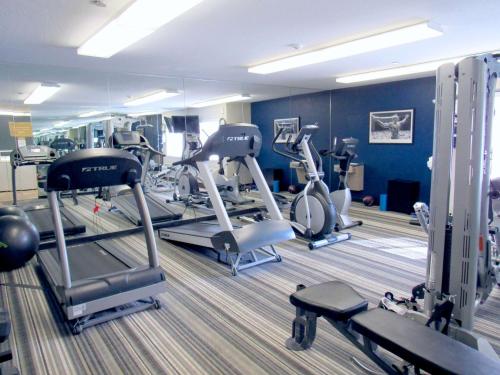 a gym with several tread machines in a room at Sonesta Simply Suites Columbus Airport Gahanna in Gahanna