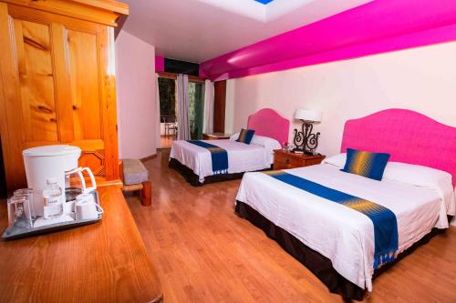 Cama o camas de una habitación en Suites Xadani