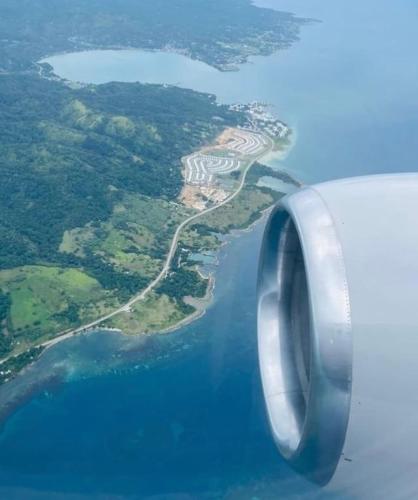 an aerial view of an island from an airplane at Natty’s Cozy Beach house in Hanover Jamaica in Point