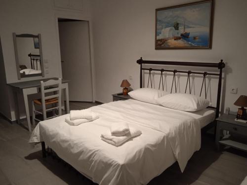 Ένα ή περισσότερα κρεβάτια σε δωμάτιο στο Mani Blue Thalassa