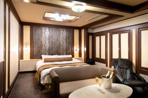 Gulta vai gultas numurā naktsmītnē Hotel Benkyo Beya Amagasaki
