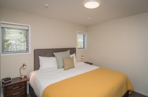 מיטה או מיטות בחדר ב-Coastal Ridge Apartments