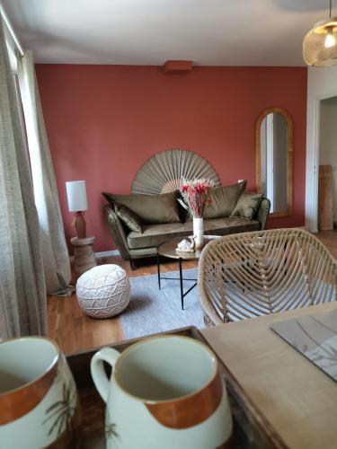a living room with a couch and a table at * LE CHAMARELLE * Hyper Centre Auray * in Auray