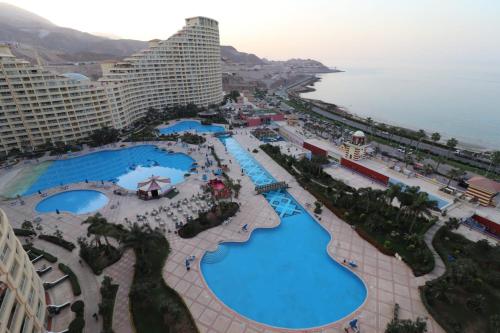 an aerial view of the pool at a resort at العين السخنة بورتو الاهرامات عائلات فقط in Ain Sokhna