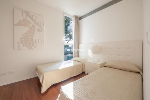 A bed or beds in a room at Jesolo Lido Village Immobiliare Pacella