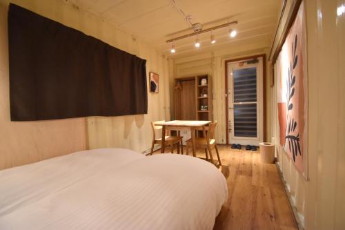 Katil atau katil-katil dalam bilik di Quaint House Naoshima