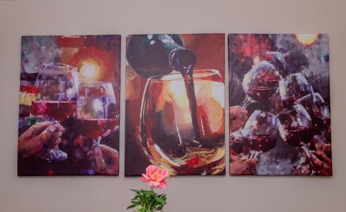 a painting of a glass of wine with a spoon at Enkarsis Resort Villa in Kitengela 