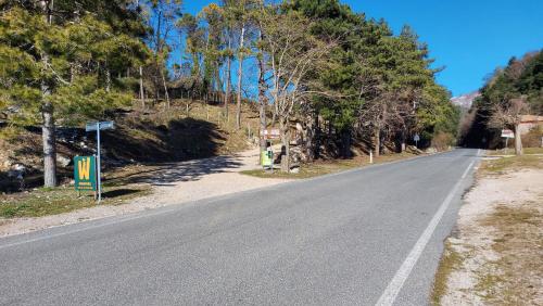 an empty road with trees on the side of the road at Ostello Ossigeno in Campodimele