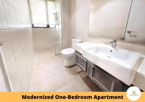 a bathroom with a sink and a toilet and a mirror at I-City I-Soho in Shah Alam