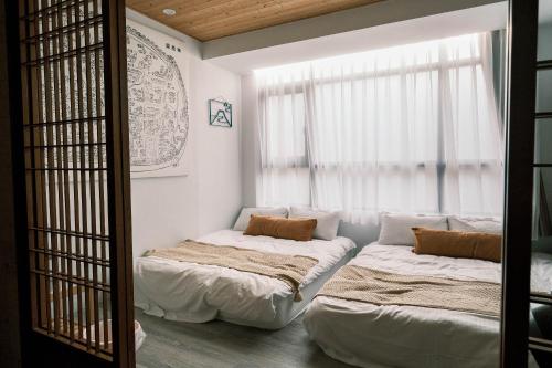 Llit o llits en una habitació de South Gate Home Stay