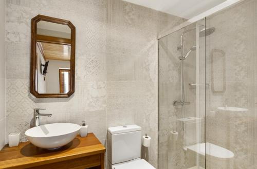 a bathroom with a sink and a glass shower at Casa Rural Francisco Mayo in Isaba