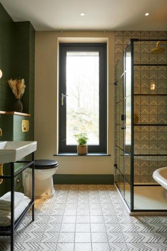 a bathroom with a toilet and a window at Rothay Manor Hotel in Ambleside