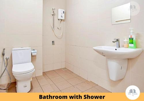 a bathroom with a toilet and a sink at Sri Rasa Homestay @ I-City, I-Soho Shah Alam in Shah Alam