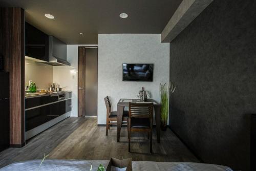 a kitchen and dining room with a table and chairs at Vacation Rent 金沢 in Kanazawa