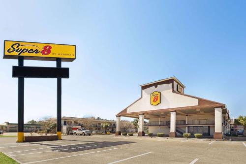a supermarket with a sign in front of it at Super 8 by Wyndham Gulfport Airport NW Near Biloxi in Gulfport