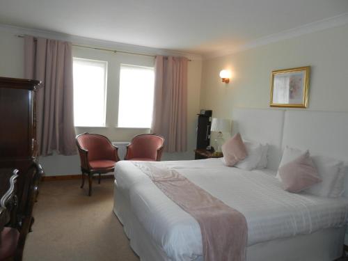 Ένα ή περισσότερα κρεβάτια σε δωμάτιο στο Mansfield Castle Hotel