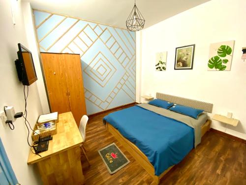 Cama ou camas em um quarto em Bluehomest - Đà Lạt Homestay