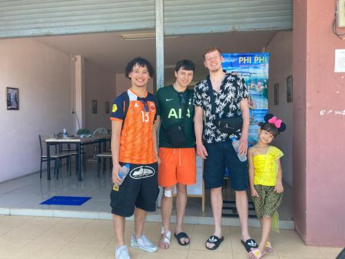 a group of four people posing for a picture at Connexion in Ko Yao Noi