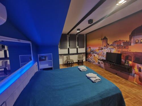 TV a/nebo společenská místnost v ubytování MM Apartman