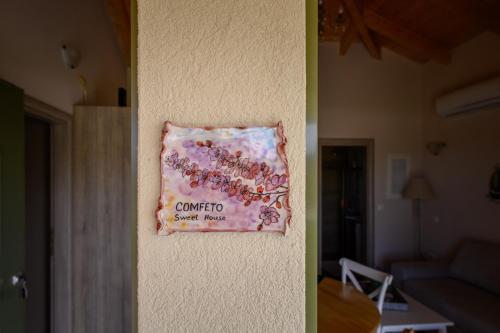a towel hanging on the side of a wall at Comfeto & Mandolato Sweet Houses in Lakithra