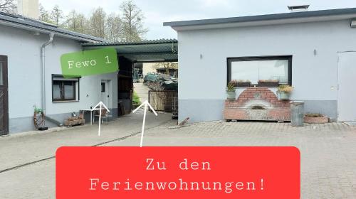 a store with a sign in front of a building at Ferienwohnung/Monteurzimmer auf dem Bauernhof in Mörlenbach