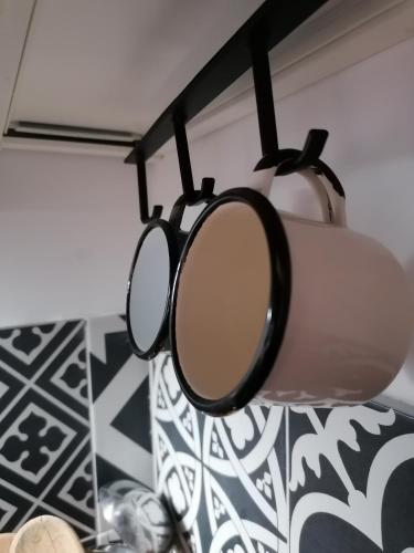 a pair of sunglasses hanging from a light fixture at Detached renovated cottage with a garden 3 min walk from the beach in Vrahati