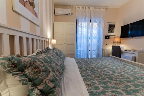 Postel nebo postele na pokoji v ubytování B&B Le Sorelle