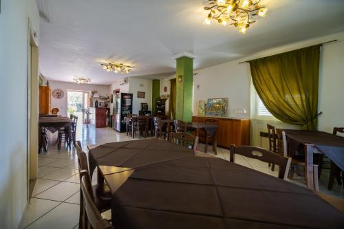 a dining room with a table and chairs and a dining room at Villa Brunella in Agropoli
