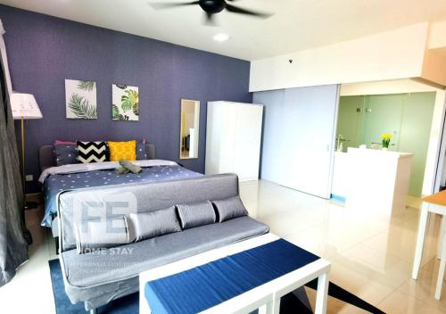 a bedroom with a bed and a ceiling fan at Netflix Wifi Trefoil Homestay Setia Alam SACC Homestay FE in Shah Alam