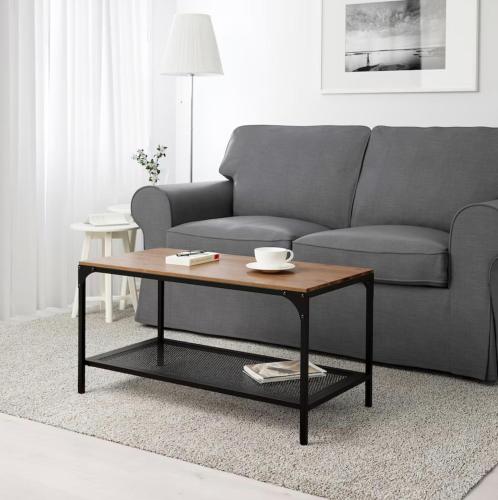 a living room with a couch and a coffee table at Seeblick Millstatt in Millstatt