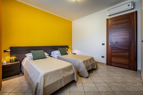 Postel nebo postele na pokoji v ubytování Arianna Apartment