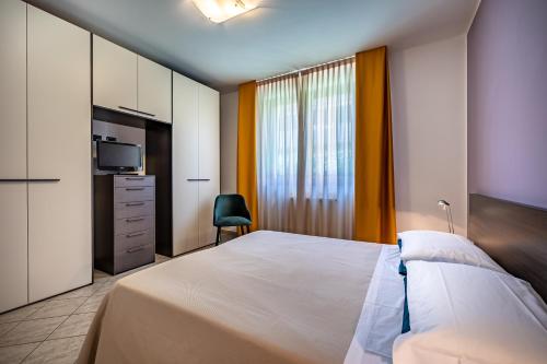 Postel nebo postele na pokoji v ubytování Arianna Apartment