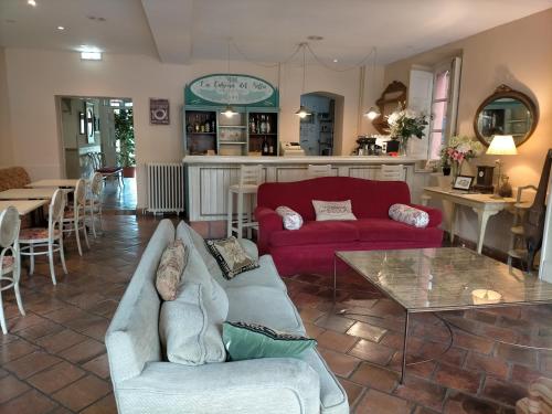 
a living room filled with furniture and a fire place at Hotel Casona del Sella in Arriondas
