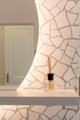 a bathroom counter with a toothbrush and a mirror at Luxury Rooms L'Avenue 2 Split in Split